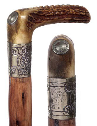 60. Swaine & Co. Stag Cane-Late 19th Century-A 4" x: 60. Swaine & Co. Stag Cane-Late 19th Century-A 4" x 1 ¼" stag handle with an inlaid silver medallion stating "Swaine & Co. London", very ornate silver collar, natural branch shaft and a horn ferrule-