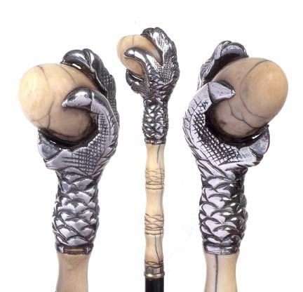 62. Ivory Egg Dress Cane-Circa 1875-A unique 7" x 1: 62. Ivory Egg Dress Cane-Circa 1875-A unique 7" x 1 ¾" ivory and silver handle, small metal collar, ebonized shaft and a bone ferrule, (small piece missing from the collar)-O.L. 36"-$500-$1,000