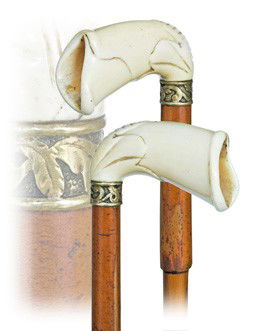 Ivory & Gold Mildly Erotic Cane-English, late 19th: Ivory & Gold Mildly Erotic Cane-English, late 19th Century-Ivory handle suggestively carved as female organ, stepped malacca shaft with 18 karat yellow gold collar and an iron ferrule. Intact and with