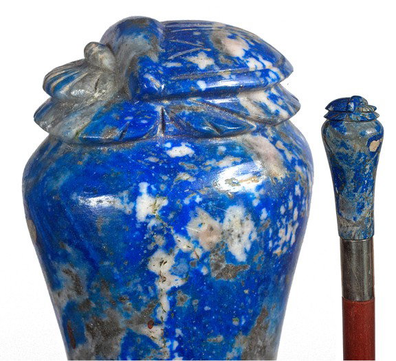 32. Sodalite Scarab Cane-20th Century-A carved hand: 32. Sodalite Scarab Cane-20th Century-A carved handle with a Egyptian symbol atop, white metal collar, replaced hardwood shaft and a metal ferrule-H. 2 ¾" x 1 ½", O.L. 36"-$300-$500