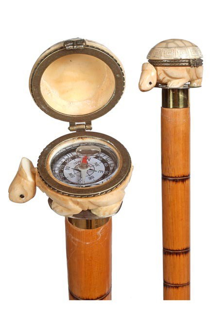 36. Turtle Compass Cane-20th Century-A carved bone: 36. Turtle Compass Cane-20th Century-A carved bone turtle box which has a fluid filled compass, brass collar and mounts, faux bamboo shaft and a white metal ferrule, probably made as a custom piece-H.