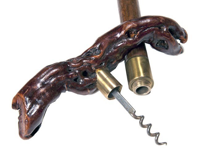 162. Corkscrew Cane-Mid 20th Century-A vine handle: 162. Corkscrew Cane-Mid 20th Century-A vine handle which also doubles as a corkscrew, brass collar, hardwood shaft and a brass ferrule. H. 1" x 7 ½", O.L. 38 ½", $150-$250
