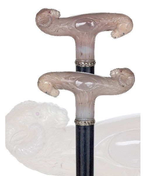 28. Figural Hardstone Dress Cane-Late 19th Century-Larg: 28. Figural Hardstone Dress Cane-Late 19th Century-Large T-shaped grey agate handle with a ram and horse head, respectively tiny ruby and sapphire eyes. Trailing laurel leaf silver collar-band, ebony