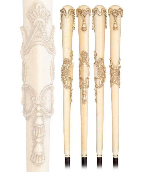 40. Dieppe Ivory Cane-Circa 1880- Long French Louis XV: 40. Dieppe Ivory Cane-Circa 1880- Long French Louis XVI ivory handle, ebony shaft, and a metal ferrule. H. 9 ½" x 1", O.L. 37 ½"