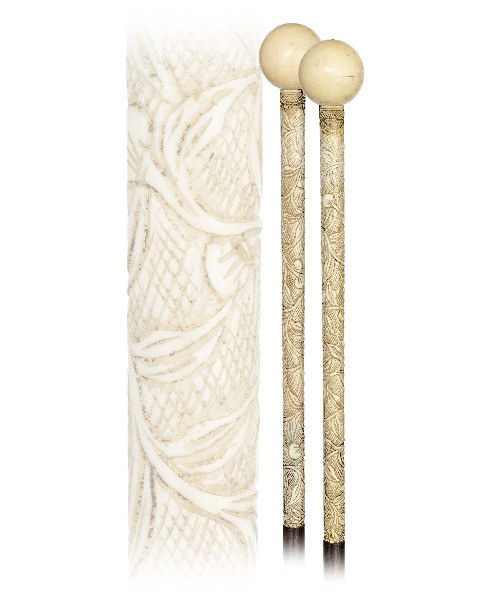 44. French Ivory Badine Cane - Circa 1900- Long ivory h: 44. French Ivory Badine Cane - Circa 1900- Long ivory handle carved with floral and topped by a plain ball, makassar ebony shaft and an ivory ferrule. H. 9" x 1 ¼", O.L. 34 ½"