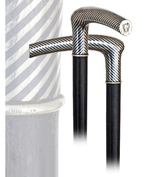 45. Tula Silver Dress Cane -Circa 1900- L-shaped Tula s: 45. Tula Silver Dress Cane -Circa 1900- L-shaped Tula silver handle with a curving hand rest and alternating bright and dark ribbons, German hallmarks and engraved "CW" initials. Ebony shaft and a met