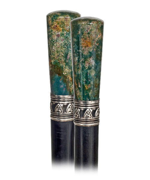 46. Heliotrope Dress Cane - Early 20th Century-Straight: 46. Heliotrope Dress Cane - Early 20th Century-Straight jasper handle of striking variegated structure and mixed colors with a chased metal collar and ebony shaft with a horn ferrule. H. 2 ½" x 1", O