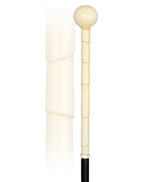 49. Ivory Badine-Circa 1900-Long ivory handle imitating: 49. Ivory Badine-Circa 1900-Long ivory handle imitating bamboo and topped by a plain ball, ebony shaft and a brass ferrule. H. 6 ¼" x 1", O.L. 35 ½"
