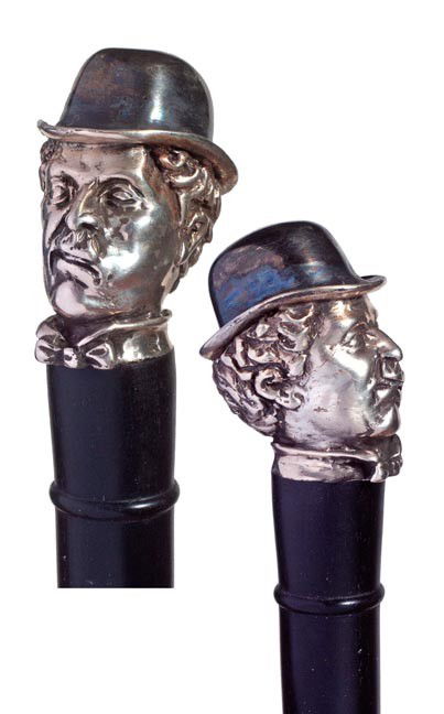 69. Sterling Charlie Chaplin Cane-Circa 1935-A most uni: 69. Sterling Charlie Chaplin Cane-Circa 1935-A most unique sterling casting of "The Tramp", hallmarked but unreadable thick ebony shaft and a bi-metal ferrule-H. 2" x 1 ½", O.L. 36"-