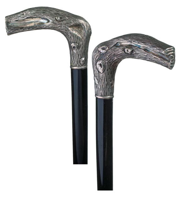 94. Silver Dress Cane-Early 20th Century-A "Solid Silve: 94. Silver Dress Cane-Early 20th Century-A "Solid Silver" cast handle, small silver collar, ebony shaft and a bi-metal ferrule-H. 3 ½" x 2 ½", O.L. 35 ½"-