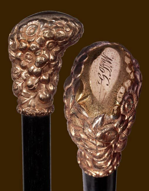 112. Gold-Filled Dress Cane-Circa 1900-A stylized high: 112. Gold-Filled Dress Cane-Circa 1900-A stylized high relief handle, ebony shaft and a bi-metal ferrule-H. 2 ¼" x 1 ¾", O.L. 35"-