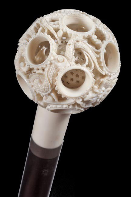 174. Chinese Bone Ball Cane-Mid 20th Century-: 174. Asian Bone Ball Cane-Mid 20th Century-A carved bone ball which has two or three other inserts, small brass collar, ebony shaft and a brass ferrule-H. 2" x 2", O.L. 34 ¾"-