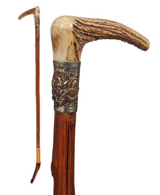 178. Riding Crop-Dated 1892-A silver custom riding crop: 178. Riding Crop-Dated 1892-A silver custom riding crop made by J. Carver, stag handle, gold colored portraits on silver commemorating Columbus and George Washington, natural vine shaft with a leather