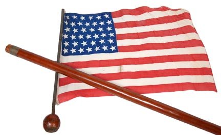 16. Thirty Nine Star American Flag System Cane-Early 20: 16. Thirty Nine Star American Flag System Cane-Early 20th Century-A carved ball handle with a copper Pegasus atop, cotton American flag, white metal collar, hollow maple shaft and a white metal ferrul