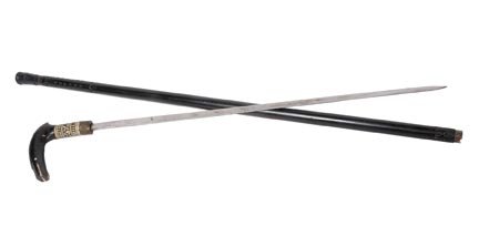 17. Indian Sword Cane-20th Century-A wood and bone hand: 17. Indian Sword Cane-20th Century-A wood and bone handle, ornate brass collar, 23" blade, ebonized shaft and a stopper ferrule-H. 4 ½" x 3 ¼", O.L. 34"