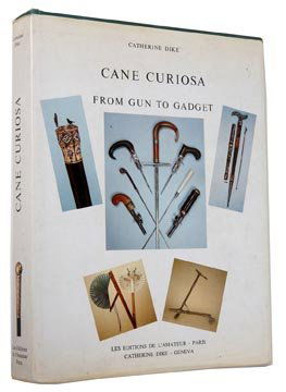 68. "Cane Curiosa, From Gun to Gadget" by Catherine Dyk: 68. "Cane Curiosa, From Gun to Gadget" by Catherine Dyke. Also inside is a personalized Christmas card from Catherine Dyke.