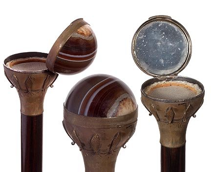 153. Agate Powder Puff Cane-Circa 1925-A compartment ca: 153. Agate Powder Puff Cane-Circa 1925-A compartment cane which has a mirror in its top and a powder screen in the bottom, hinged and locks, ornate lower section, exotic wood shaft and a horn ferrule-