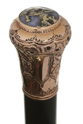 11. Gold Quartz and Garnet Dress Cane-Ca. 1900-A 14kt g: 11. Gold Quartz and Garnet Dress Cane-Ca. 1900-A 14kt gold handle with a gold quartz disc atop, inlaid garnets throughout the gold work, not of the Gold Rush Era, but a quality dress cane, ebony shaft