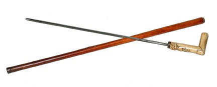 151. Bone Sword Cane-Ca. 1850-A two piece carved bone h: 151. Bone Sword Cane-Ca. 1850-A two piece carved bone handle with a tortoise shell end cap, marsh deer and palm tree, brass collar, 4-sided 21” original blade, split Malacca shaft and a metal ferrul