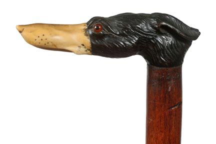 40. Ebony and Ivory Dog Cane-Ca. 1890-A whimsical carvi: 40. Ebony and Ivory Dog Cane-Ca. 1890-A whimsical carving with an ivory snout and an ebony head, two color glass eyes, twigspur hickory shaft and a brass ferrule-H. 4 ¾” x 1 1/2”, O.L. 33 ½”-