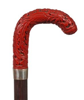 78. Cinnabar Dress Cane-Ca. 1920-A fine Asian carving w: 78. Cinnabar Dress Cane-Ca. 1920-A fine Asian carving with no problems, silver metal collar, ebony shaft and a horn ferrule-H. 4” x 3 ¾”, O.L. 35 ¼”-