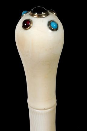 117. Ivory Jewelry Cane-Ca. 1900-A pommel handle with t: 117. Ivory Jewelry Cane-Ca. 1900-A pommel handle with turquoise and what appear to be garnets in gold sets attached to the top, six piece segmented elephant ivory cane and no ferrule-H. 1 ¼” x 2 ¼
