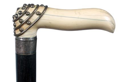123. Ivory and Silver Dress Cane-Ca. 1890-A well carved: 123. Ivory and Silver Dress Cane-Ca. 1890-A well carved ivory handle with a beaded overlay of silver, engraved silver collar “Colonel E. F. Gosset”, thick ebony shaft and a horn ferrule-H. 4 ½”