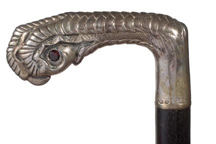 241. Silver Defensive Cane-Early 20th Century-Silver pl: 241. Silver Defensive Cane-Early 20th Century-Silver plated talon with two red stones which are faceted, signed in oriental characters, thick ebony shaft and a bi-metal ferrule-H. 4 ½” x 2 ¼”, O