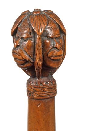 242. Kepkypa Carved Cane-Early 20th Century-A carved ha: 242. Kepkypa Carved Cane-Early 20th Century-A carved handle with various human and primate faces from the Ionian Sea Greek Island, hardwood shaft and a metal ferrule-H. 1 ¾” x 2 ½”, O.L. 36”-