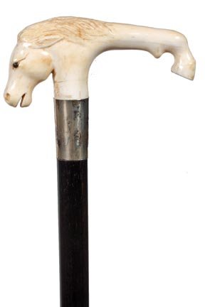 253. Ivory Horse Cane-Ca. 1900-A carved ivory horse hea: 253. Ivory Horse Cane-Ca. 1900-A carved ivory horse head with glass eyes and hoof, silver collar, ebony shaft and a bone ferrule-H. 4” x 2”, O.L. 35”-