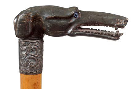 258. Bone Whippet Dress Cane-Ca. 1900-A carved buffalo : 258. Bone Whippet Dress Cane-Ca. 1900-A carved buffalo horn dog with two color glass eyes, ornate silver metal collar, Malacca shaft and a metal ferrule-H. 4 ¾” x 1 5/8”, O.L. 37”-