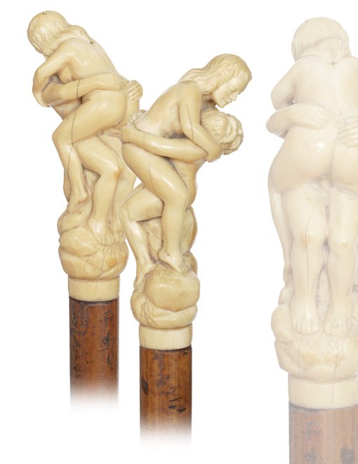 44. Ivory Erotic Cane-Ca. 1890-A sizeable ivory han: 44. Ivory Erotic Cane-Ca. 1890-A sizeable ivory handle with a beautiful young girl and an old man together twined in an erotic embrace, malacca shaft and a metal ferrule. The passionate depiction is i
