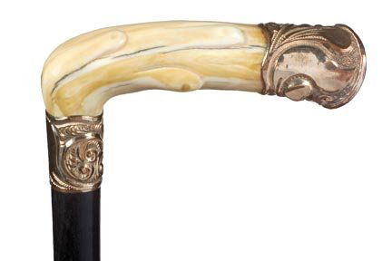 87. Ivory and Gold Dress Cane-Ca. 1880-A carved ivo: 87. Ivory and Gold Dress Cane-Ca. 1880-A carved ivory handle with gold filled end cap, gold filled ornate collar, ebony shaft and an ivory ferrule-H. 5 x 1 , O.L. 35 -