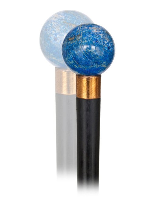 105. Lapis Lazuli Dress Cane-Early 20th Century.-L: 105. Lapis Lazuli Dress Cane-Early 20th Century.-Lapis lazuli ball knob of a natural pale blue color with gold dust, gilt collar, ebony shaft and a horn ferrule.-H. 1 x 1 , O.L. 38-