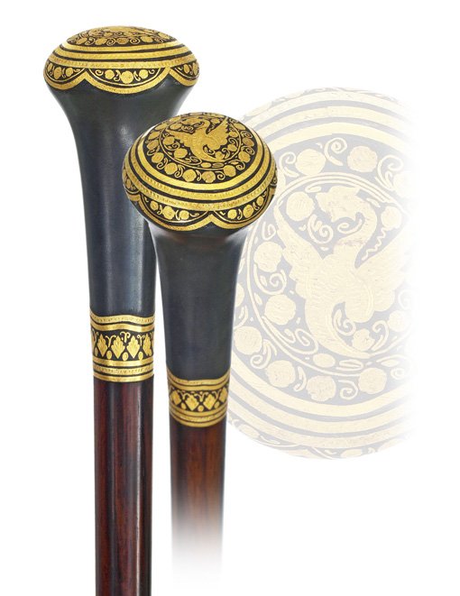 120. Toledo Dress Cane-Spain, Ca. 1885-A remarkabl: 120. Toledo Dress Cane-Spain, Ca. 1885-A remarkable Toledo steel knob with dense 24 karat yellow gold and silver wire Damascene work with arabesque and trellises within multiple frames, ebony shaft an