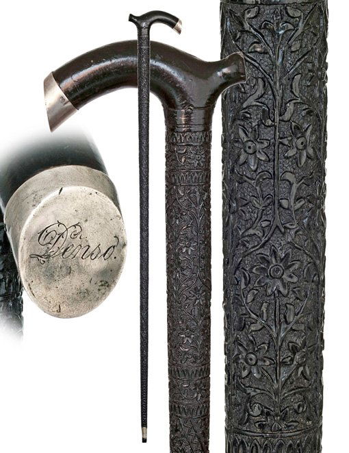 140. Parade Cane-19th Century-All deep black ebony: 140. Parade Cane-19th Century-All deep black ebony cane with a modified Opera handle with front silver cap engraved Densoon a substantial one piece shaft with fretted micro carving from top to bottom