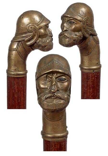 226. Defensive Weapon Cane-Ca. 1900-A bell bronze: 226. Defensive Weapon Cane-Ca. 1900-A bell bronze heavy casting of a one-eyed soldier, thick pine shaft and a large brass ferrule-H. 3 " x 2 ", O.L. 32 ",