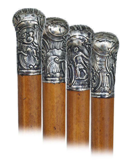 46. Silver Noble Man’s Cane-18th Century-Substantial si: 46. Silver Noble Man’s Cane-18th Century-Substantial silver knob hand chased and engraved with two panels within rich Baroque framing, well dressed malacca shaft and a metal ferrule. -2 ¾” x 1 ½