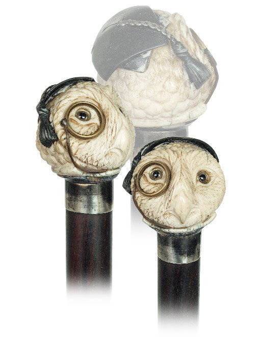 56. Ivory Graduate Owl head Cane-Ca. 1900-Well carved a: 56. Ivory Graduate Owl head Cane-Ca. 1900-Well carved and amusing ivory “Graduate”owl head with a monocle and a silver tasseled Tudor Bonnet, inset glass eyes, ebony shaft, silver collar and horn
