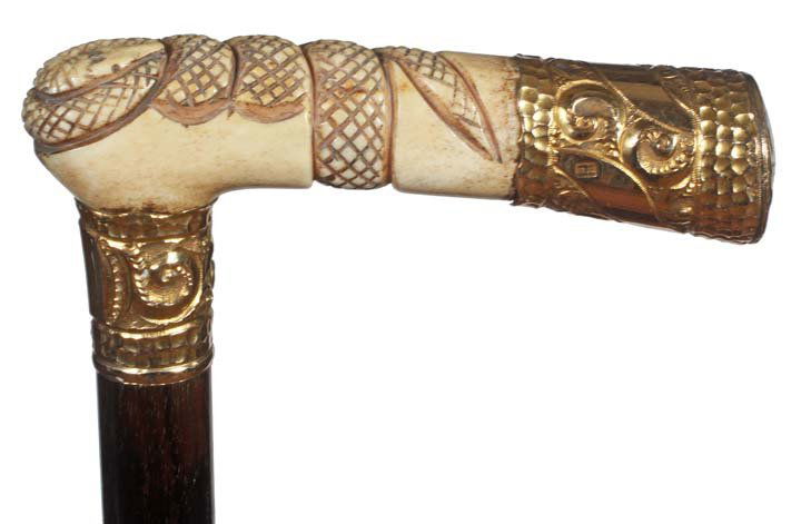 75. Snake Bone Dress Cane-Ca. 1885- A unique carved bon: 75. Snake Bone Dress Cane-Ca. 1885- A unique carved bone snake with a gold filled end cap, hallmarked, “H”, ornate gold filled collar, ebonized shaft and a bone ferrule-H. 4” x 1 1/8”, O.L. 36