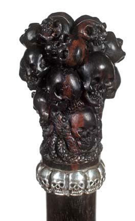 92. Ebony Skull Dress Cane-20th Century-A uniquely carv: 92. Ebony Skull Dress Cane-20th Century-A uniquely carved handle with skulls and snakes, silver skull cast collar, ebony shaft and a 2” ivory ferrule-H. 1 ½” 2 ½”, O.L. 36 ½”