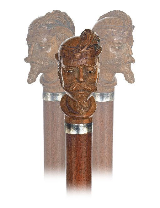 121. Figural Day Cane-Ca. 1890-Well carved boxwood Robi: 121. Figural Day Cane-Ca. 1890-Well carved boxwood Robin Hood knob showing the heroic outlaw reputed for “robbing from the rich and giving to the poor” with a feather hat and inset glass eyes on a