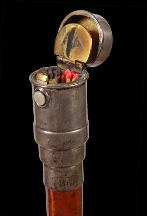 62. Vesta Silver Cane-Ca. 1890-An unusual match holder : 62. Vesta Silver Cane-Ca. 1890-An unusual match holder with a shagreen striker atop, mother of pearl push button mechanism, brass striking mechanism inside also, 1 ¼” malacca shaft and a horn ferru
