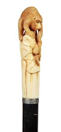 66. Asian Ivory Cane-Ca. 1890-A carved Asian handle wit: 66. Asian Ivory Cane-Ca. 1890-A carved Asian handle with a mother ape and her child, ornate silver metal collar, ebony shaft and a metal ferrule-H. 4 ¼” x 1 ¼”, O.L. 35”-