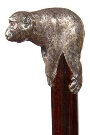 74. Silver Gorilla Cane-Ca. 1940-A sterling Gorham soli: 74. Silver Gorilla Cane-Ca. 1940-A sterling Gorham solid cast handle with ruby eyes, exotic wood shaft and a metal ferrule-H. 2 ½” x 2 ½”, O.L. 35 ½”-