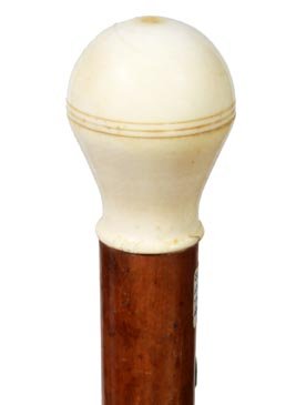 78. Ivory Sewing Box Cane-Ca. 1885-An ivory compartment: 78. Ivory Sewing Box Cane-Ca. 1885-An ivory compartment cane which contains an ivory thimble and bobbin, needles, malacca shaft and a horn ferrule-H. 2” x 1 ½”, O.L. 35”-