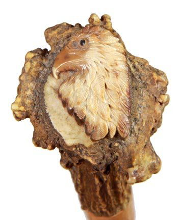 158. Folk Art Cane-Ca. 1925-The best Mexican folk art c: 158. Folk Art Cane-Ca. 1925-The best Mexican folk art cane that we have seen, elk antler handle with a carved eagle, various carvings including an explorer, Indian, animals and trees, hardwood shaft a