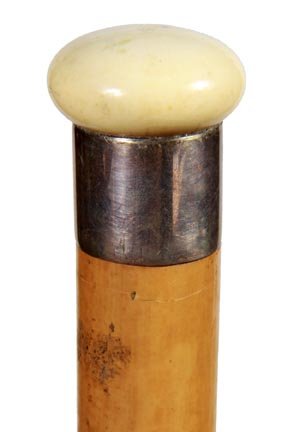 167. Measuring System Cane-Ca. 1885-A container cane wh: 167. Measuring System Cane-Ca. 1885-A container cane which holds a round 36” stick on one side and the other side measures in fractions of a yard, silver metal collar, ivory handle atop, malacca sha