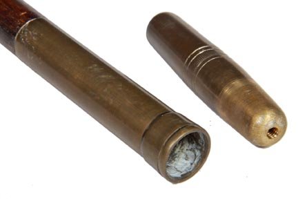 202. Manicure System Cane-Ca. 1925-A brass compartment : 202. Manicure System Cane-Ca. 1925-A brass compartment cane which holds a pair of scissors and a small knife, large brass collar, stained hardwood shaft and a brass ferrule-H. 5” x 5/8”, O.L. 38��