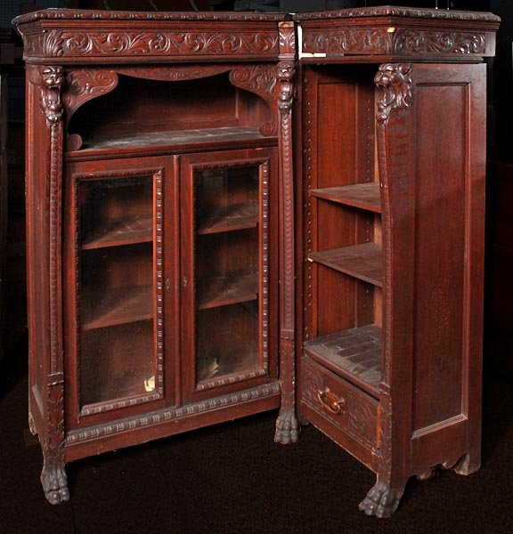 Carved lion oak corner bookcase, late 19th C., prime co
